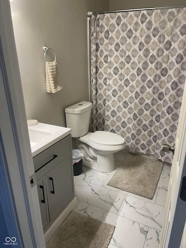 880 N Avon Ave, Avon, IN 46123 - bathroom featuring vanity, marble look tiles, and curtained shower