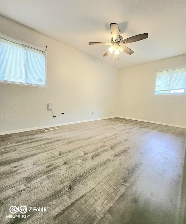 731 Sunset Blvd, Greenwood, IN 46142 - unfurnished room featuring baseboards, a ceiling fan, and wood finished floors