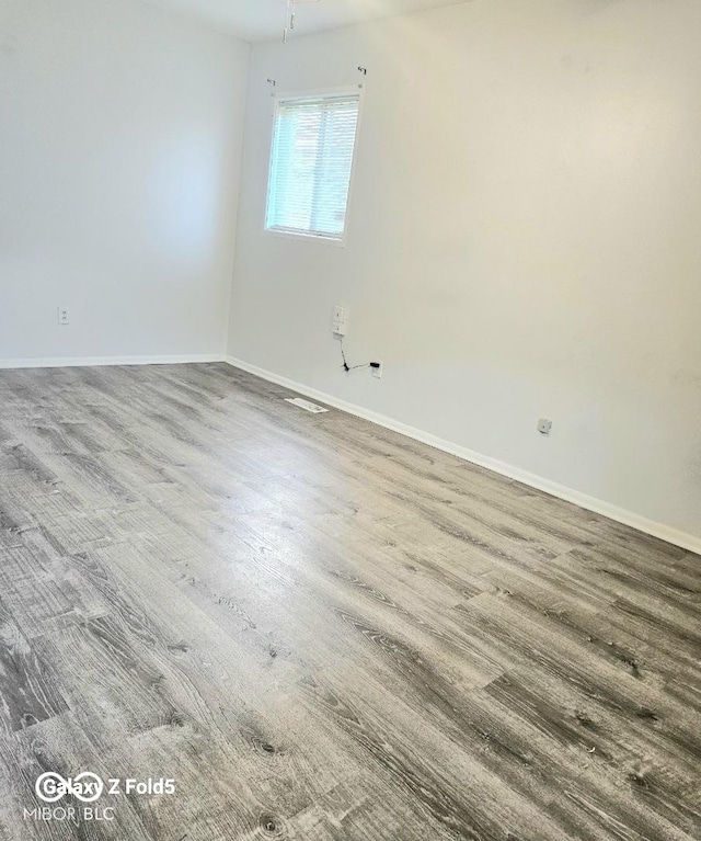 731 Sunset Blvd, Greenwood, IN 46142 - spare room featuring baseboards and wood finished floors