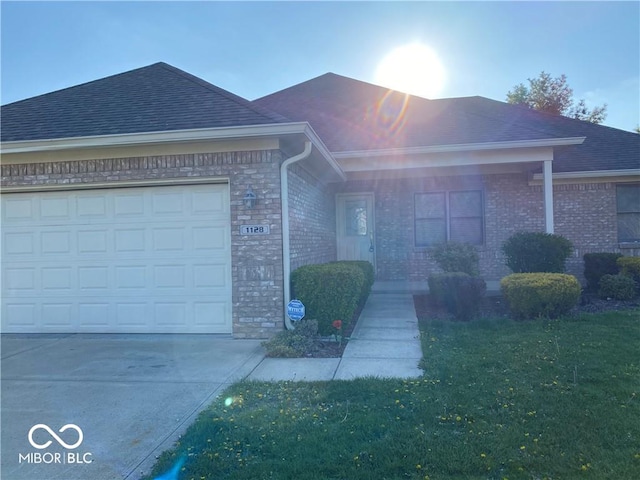 1128 Brookside Ct, Avon, IN 46123 - single story home with an attached garage, driveway, roof with shingles, a front lawn, and brick siding
