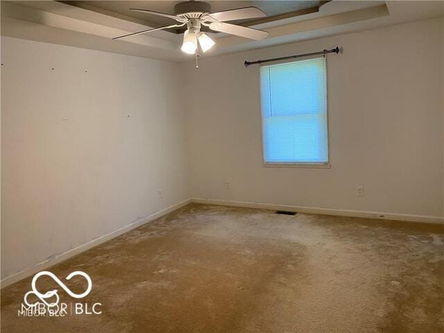 1128 Brookside Ct, Avon, IN 46123 - carpeted empty room featuring ceiling fan and a raised ceiling