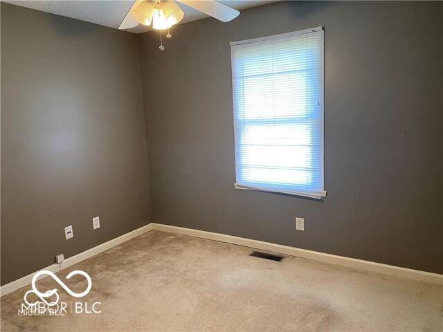 1128 Brookside Ct, Avon, IN 46123 - carpeted empty room with a ceiling fan and baseboards