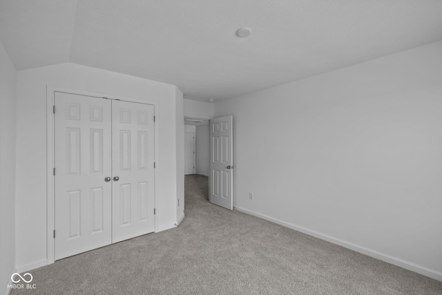 12490 Morning Ridge Way, Noblesville, IN 46060 - unfurnished bedroom featuring carpet floors, a closet, and lofted ceiling