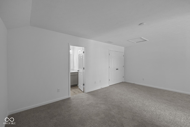12490 Morning Ridge Way, Noblesville, IN 46060 - unfurnished bedroom featuring carpet floors, attic access, vaulted ceiling, and connected bathroom