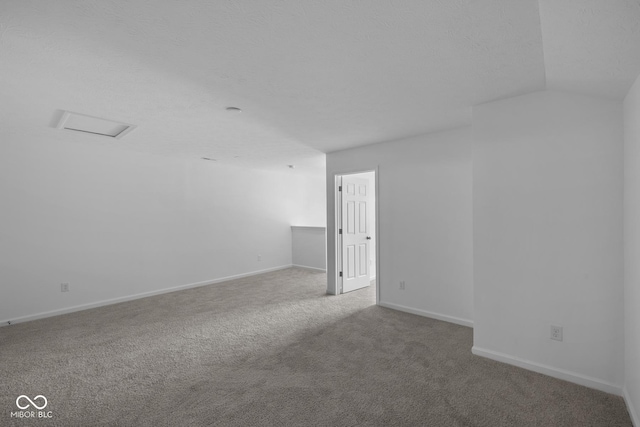 12490 Morning Ridge Way, Noblesville, IN 46060 - spare room featuring carpet floors and vaulted ceiling