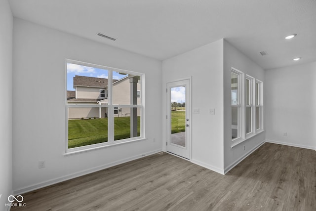 12490 Morning Ridge Way, Noblesville, IN 46060 - empty room with wood finished floors and recessed lighting