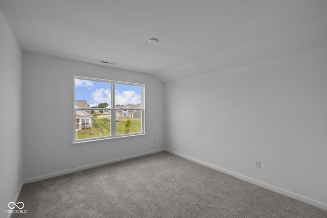 12490 Morning Ridge Way, Noblesville, IN 46060 - carpeted spare room with vaulted ceiling and baseboards