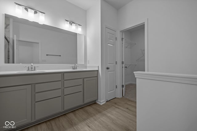 12490 Morning Ridge Way, Noblesville, IN 46060 - full bath with double vanity, wood finished floors, and a spacious closet