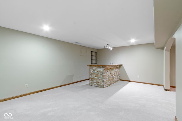 5037 Surrey Ln, Carmel, IN 46033 - finished below grade area featuring a bar, carpet floors, and recessed lighting