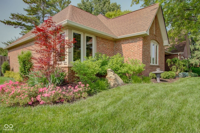 5037 Surrey Ln, Carmel, IN 46033 - view of property exterior featuring brick siding, a lawn, and roof with shingles