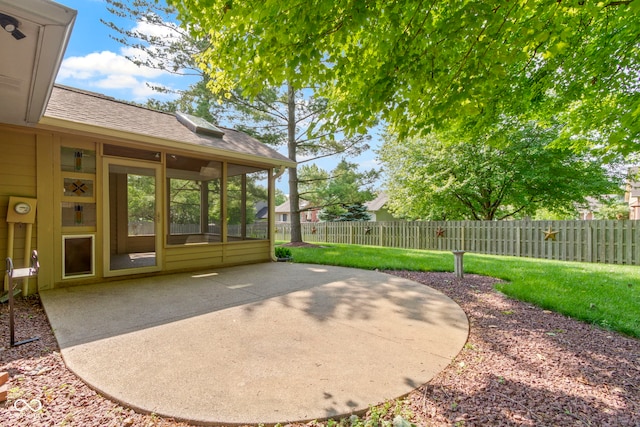 5037 Surrey Ln, Carmel, IN 46033 - fenced backyard featuring a patio and a sunroom