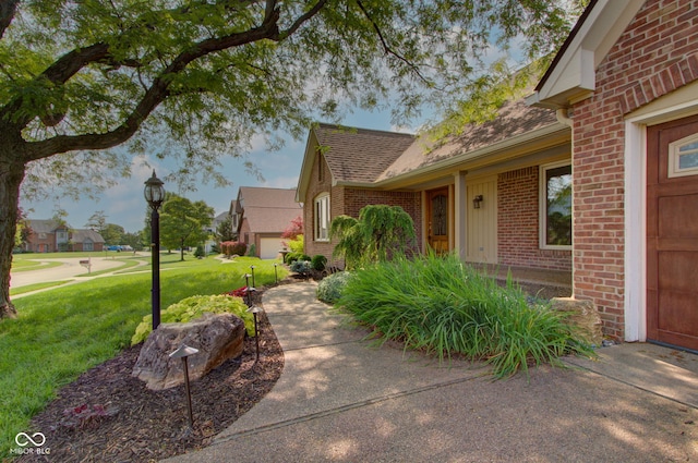 5037 Surrey Ln, Carmel, IN 46033 - view of property exterior featuring brick siding, a lawn, and roof with shingles
