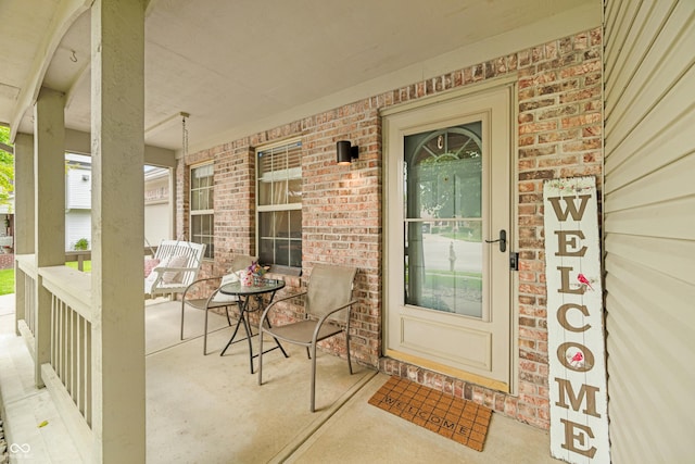 7833 Meadow Bend Dr, Indianapolis, IN 46259 - property entrance featuring covered porch and brick siding