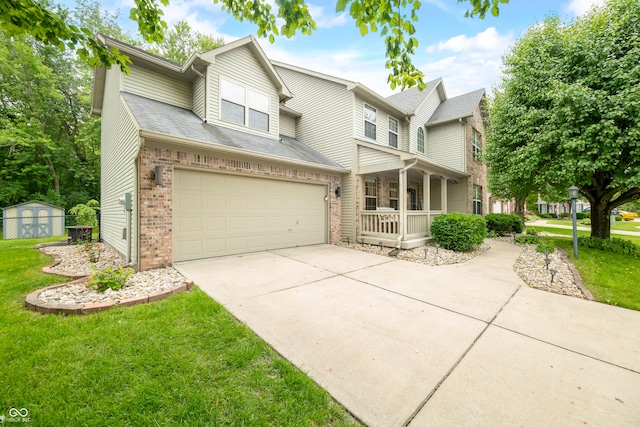 7833 Meadow Bend Dr, Indianapolis, IN 46259 - view of front of home with brick siding, covered porch, driveway, and a garage