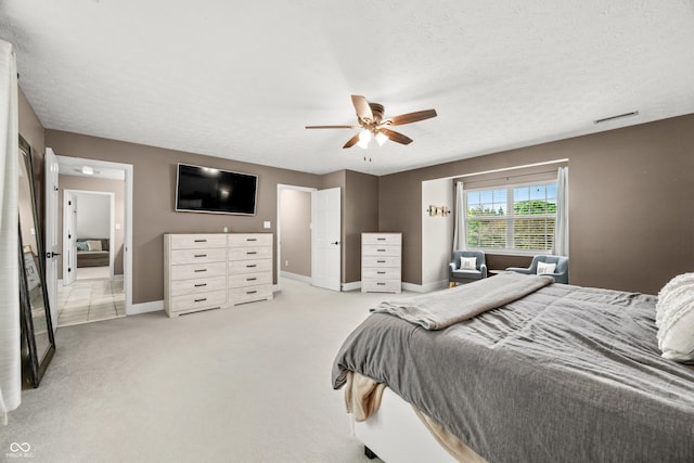 7833 Meadow Bend Dr, Indianapolis, IN 46259 - bedroom with baseboards, light carpet, a ceiling fan, and a textured ceiling