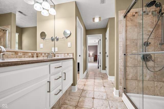 7833 Meadow Bend Dr, Indianapolis, IN 46259 - bathroom featuring vanity, a stall shower, a textured ceiling, and tile patterned floors