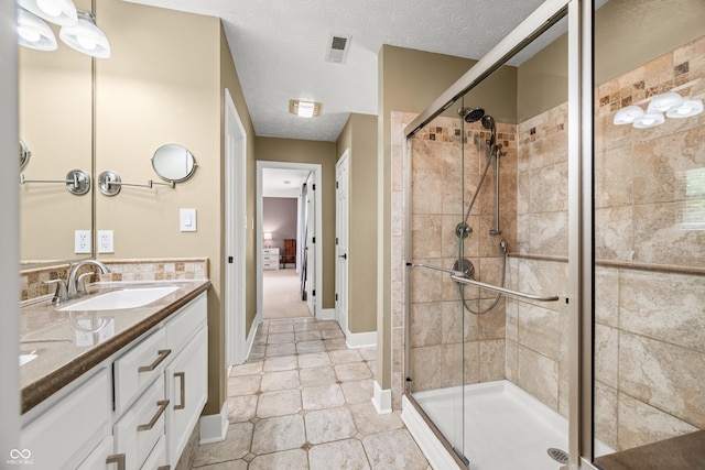7833 Meadow Bend Dr, Indianapolis, IN 46259 - full bath with a stall shower, double vanity, tile patterned floors, and a textured ceiling