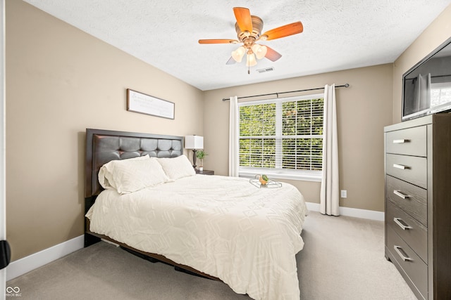 7833 Meadow Bend Dr, Indianapolis, IN 46259 - bedroom featuring light carpet, baseboards, ceiling fan, and a textured ceiling