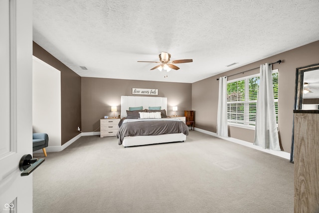 7833 Meadow Bend Dr, Indianapolis, IN 46259 - bedroom featuring baseboards, carpet, ceiling fan, and a textured ceiling