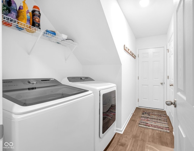 12105 Fall Ct, Indianapolis, IN 46229 - laundry room featuring separate washer and dryer and wood finished floors