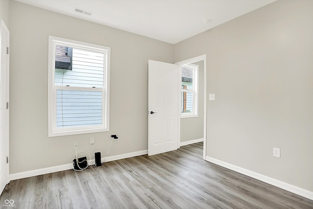 1338 N Parker Ave, Indianapolis, IN 46201 - empty room featuring wood finished floors and baseboards