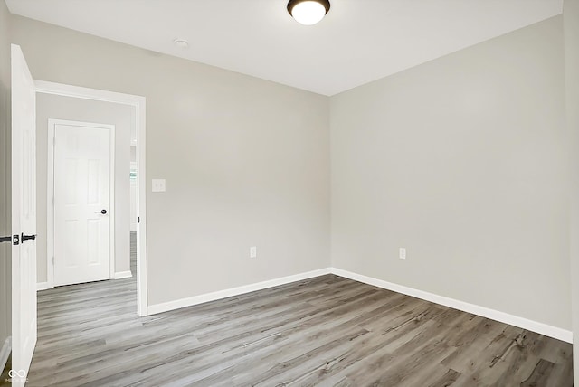 1338 N Parker Ave, Indianapolis, IN 46201 - unfurnished room featuring wood finished floors and baseboards