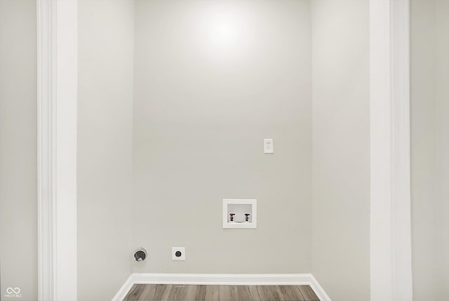 1338 N Parker Ave, Indianapolis, IN 46201 - washroom featuring hookup for a washing machine, electric dryer hookup, wood finished floors, and baseboards
