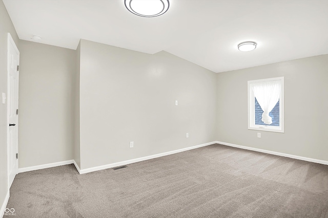1338 N Parker Ave, Indianapolis, IN 46201 - carpeted empty room with baseboards