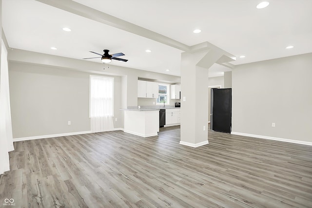 1338 N Parker Ave, Indianapolis, IN 46201 - unfurnished living room featuring light wood-type flooring, a ceiling fan, baseboards, and recessed lighting