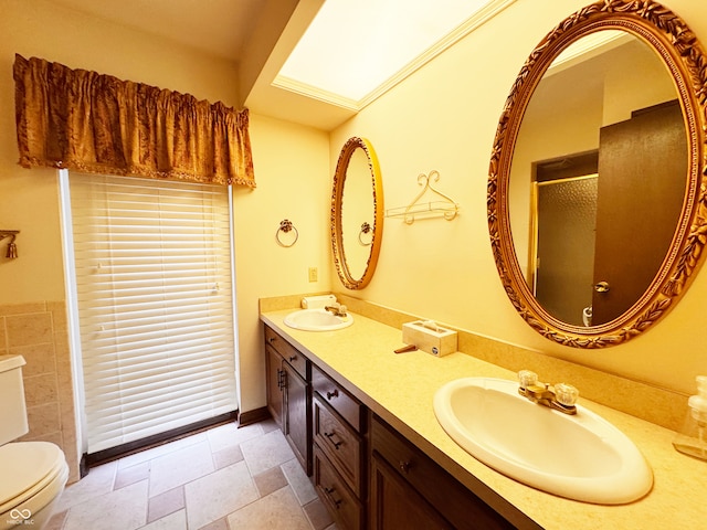 7038 E 65th St, Indianapolis, IN 46256 - full bathroom featuring a stall shower, double vanity, and stone tile floors