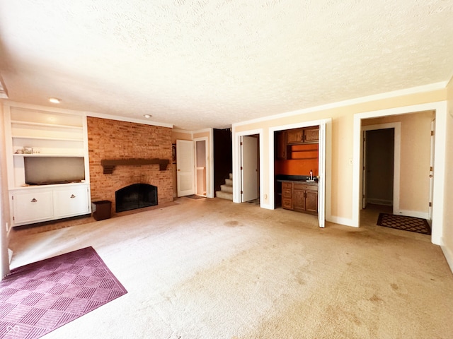 7038 E 65th St, Indianapolis, IN 46256 - unfurnished living room with a textured ceiling, light carpet, a brick fireplace, and built in features