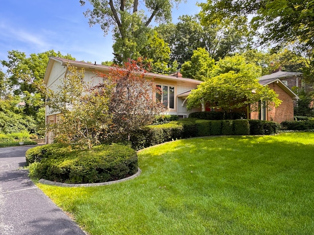 7038 E 65th St, Indianapolis, IN 46256 - view of front of home with a front yard