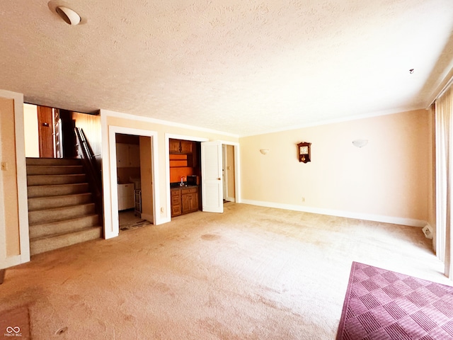 7038 E 65th St, Indianapolis, IN 46256 - unfurnished living room with light carpet, a textured ceiling, and stairway