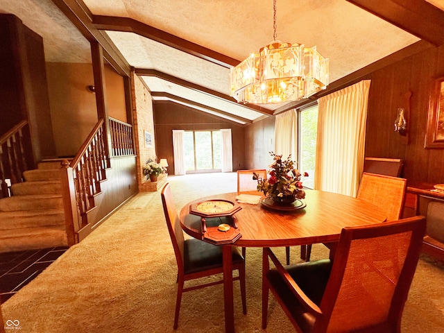 7038 E 65th St, Indianapolis, IN 46256 - dining space with a chandelier, stairs, wooden walls, and carpet floors