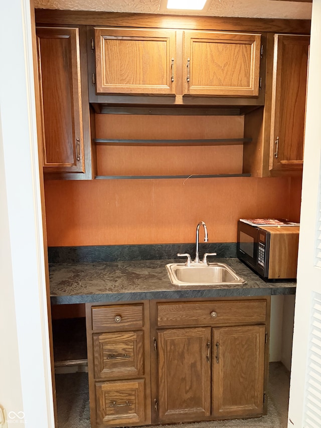 7038 E 65th St, Indianapolis, IN 46256 - kitchen featuring black microwave and dark countertops