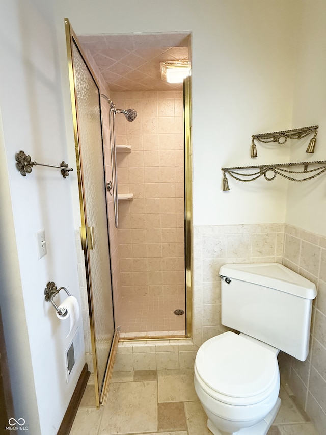 7038 E 65th St, Indianapolis, IN 46256 - full bathroom with a stall shower, tile walls, and wainscoting