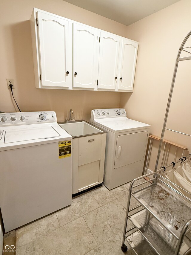 7038 E 65th St, Indianapolis, IN 46256 - washroom featuring cabinet space and separate washer and dryer
