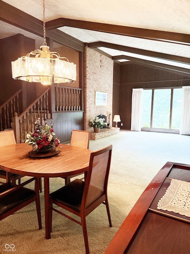 7038 E 65th St, Indianapolis, IN 46256 - dining room featuring a chandelier, carpet floors, stairs, and wood walls