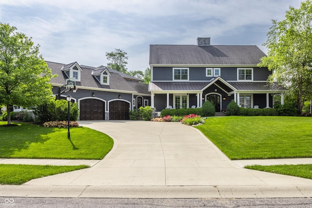 10974 Harbor Bay Dr, Fishers, IN 46040 - view of front of home featuring a front lawn, concrete driveway, a garage, and a chimney