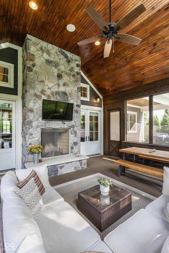 10974 Harbor Bay Dr, Fishers, IN 46040 - living room with wooden ceiling, carpet, a ceiling fan, an outdoor stone fireplace, and high vaulted ceiling
