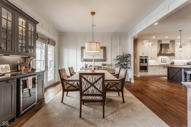 10974 Harbor Bay Dr, Fishers, IN 46040 - dining room featuring wine cooler, dark wood-type flooring, and recessed lighting