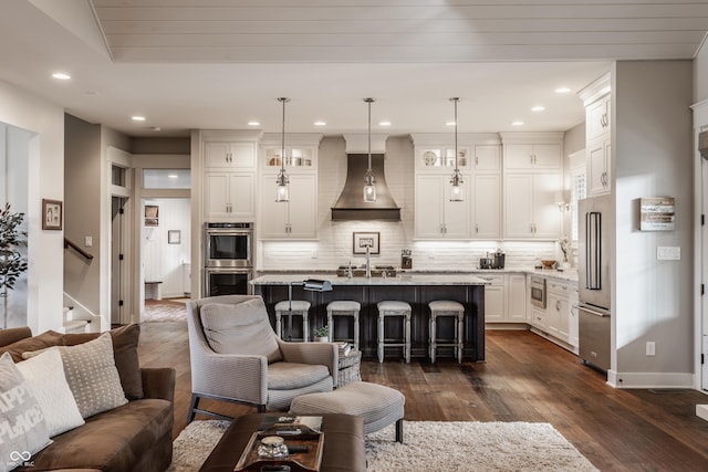 10974 Harbor Bay Dr, Fishers, IN 46040 - living room featuring dark wood-type flooring, stairway, and recessed lighting