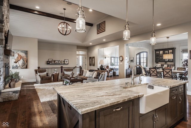10974 Harbor Bay Dr, Fishers, IN 46040 - kitchen with open floor plan, lofted ceiling, dark brown cabinets, dark wood-style flooring, and recessed lighting