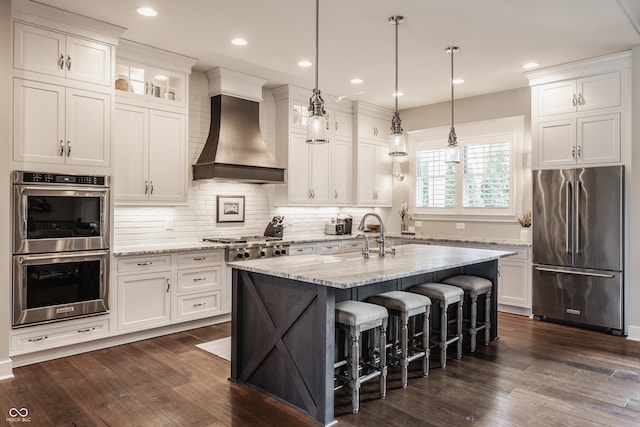 10974 Harbor Bay Dr, Fishers, IN 46040 - kitchen with appliances with stainless steel finishes, wall chimney range hood, white cabinets, and recessed lighting