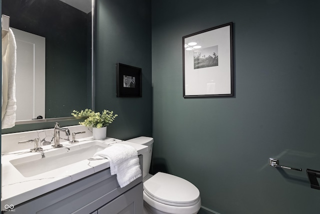 2051-2053 Columbia Ave, Indianapolis, IN 46202 - bathroom featuring vanity, toilet, and baseboards