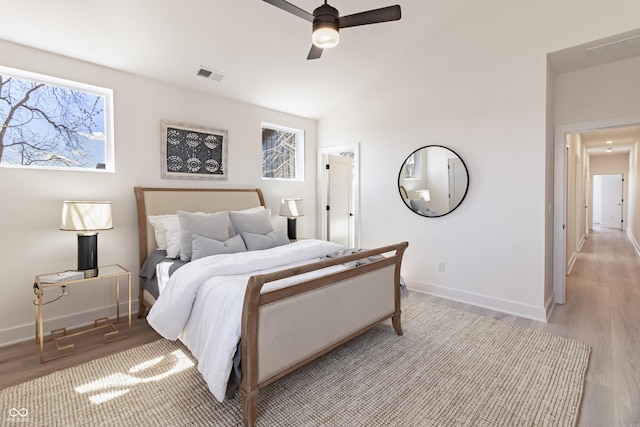 2051-2053 Columbia Ave, Indianapolis, IN 46202 - bedroom with light wood-style flooring, baseboards, vaulted ceiling, and a ceiling fan