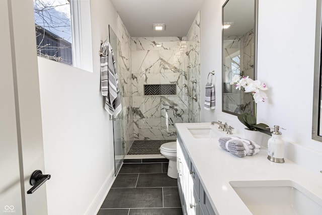 2051-2053 Columbia Ave, Indianapolis, IN 46202 - bathroom featuring toilet, a marble finish shower, double vanity, tile patterned floors, and plenty of natural light