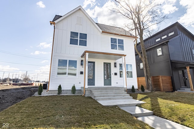 2051-2053 Columbia Ave, Indianapolis, IN 46202 - view of front of home with board and batten siding and entry steps