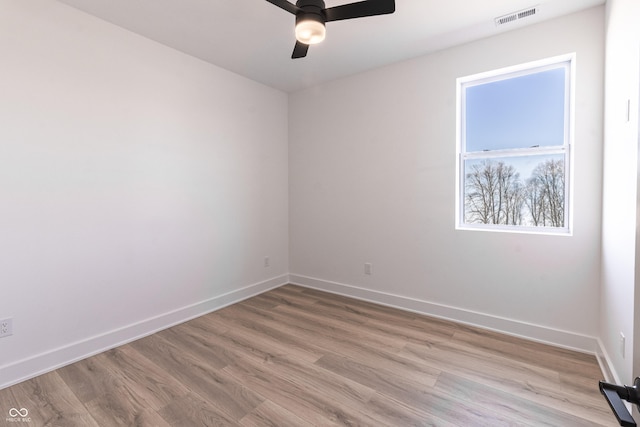 2051-2053 Columbia Ave, Indianapolis, IN 46202 - spare room with ceiling fan, baseboards, and light wood-style flooring