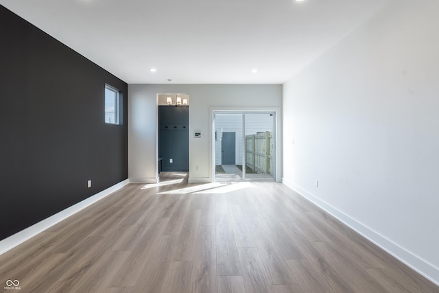 2051-2053 Columbia Ave, Indianapolis, IN 46202 - empty room with wood finished floors, recessed lighting, and baseboards